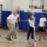 <p>Taking a turn jumping is Lifting Up Westchester Executive Director Paul Anderson-Winchell.</p>