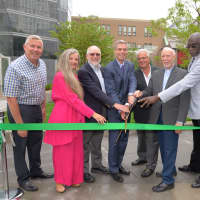 <p>Dedicating a new park in downtown White Plains are, from left, Common Council members John Martin, Milagros Lecuona and John Kirkpatrick; Mayor Thomas Roach; Louis Cappelli, the Rev. Richard A. Kunz and Walter Simon, senior warden of Grace Church.</p>