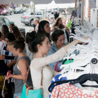 <p>Area shoppers flock to Darien&#x27;s SideWalk Sales along the Post Road.</p>