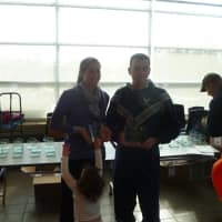 <p>Meade Fogel, the top female finisher and Jason Dufour, the Reservoir Run winner, at a ceremony after the race. </p>