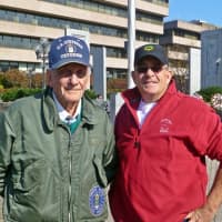 <p>World War II veteran Lewis Jackson and his son, Lee, stand together at Veterans Park in Stamford.</p>