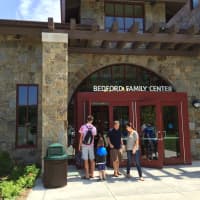 <p>Campers and parents enter the Westport Weston Family YMCA on Friday.</p>