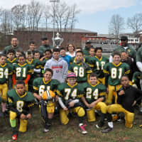 <p>The Norwalk Packers fourth-grade football team celebrates its second-place state finish Sunday in Meriden.</p>