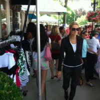 <p>Shoppers at the sidewalk sales on Friday.</p>