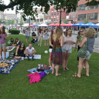 <p>Music lovers, families and children lounge on the grounds at Columbus Park, listening to the opening act at Thursday&#x27;s concert.</p>