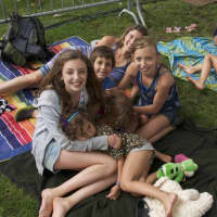 <p>Music lovers, families and children lounge on the grounds at Columbus Park listening to the opening act at Thursday&#x27;s concert.</p>