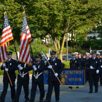 <p>Mount Kisco firefighters march in their hometown parade.</p>