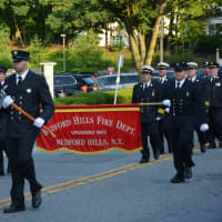 <p>Bedford Hills firefighters march in the Mount Kisco parade.</p>