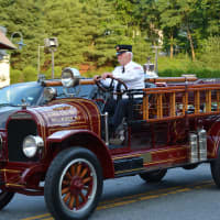 <p>An antique Millwood firetruck is driven in the Mount Kisco parade.</p>