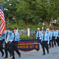 <p>Pound Ridge firefighters march in the Mount Kisco parade.</p>