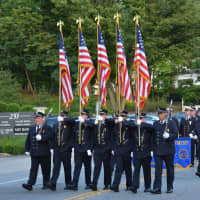 <p>Ossining firefighters march in the Mount Kisco parade.</p>