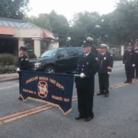 <p>Briarcliff Manor firefighters march in the Mount Kisco parade.</p>