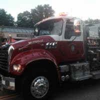<p>A Banksville firetruck is driven in the Mount Kisco parade.</p>