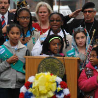 <p>Peekskill Girl Scouts lead the Pledge of Allegiance.</p>