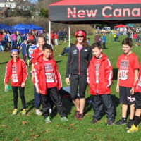 <p>New Canaan runners (left to right) Dixie DAmelio, Cali Brannan, Dylan Wiedtfeldt, Christian Meier, Christopher Carratu and  Henry Asker stand with coach Alexandra Portonova.</p>