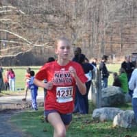 <p>New Canaan&#x27;s Cali Brannan hustles to a third place finish in her division at the Junior Olympic state cross country championships.</p>