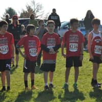 <p>New Canaan runners (left to right) Christopher Carratu, Henry Asker, Christian Meier and Dylan Wiedtfeldt get ready at the starting line.</p>