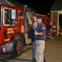 <p>Somers resident Paul Faust and Rockaway fire chief Mike Valentine worked together to provide relief to the community.</p>