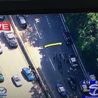 <p>Police activity on the Bronx River Parkway centers on the area near the black car near the Cross County Parkway (highlighted). </p>