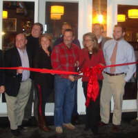 <p>Jimmy Love cuts the ribbon on Jimmy&#x27;s Southside Tavern with members of the Darien Chamber of Commerce.</p>