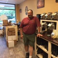 <p>White Plains resident Richard Cozza in his new store, The Twisted Branch.</p>