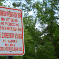 <p>A sign posted warns people not to litter in the conservation area located off of Lieto Drive in Mount Kisco.</p>