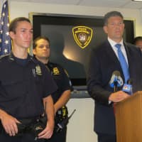 <p>Greenburgh Police Officer Peter Schmidt Jr., front left, drew praise from Chief Chris McNerney, right, during a Tuesday news conference for helping catch two suspects charged with trying to murder Schmidt&#x27;s father in Elmsford on Monday.</p>