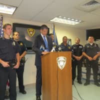 <p>Greenburgh Police Chief Chris McNerney, at the podium, is flanked by town police officers he credited with helping catch two shooting suspects on Monday.</p>