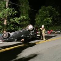 <p>Putnam Valley volunteer firefighters at the scene of a one-car crash on Oscawana Lake Road on Wednesday night.</p>