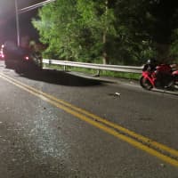 <p>This angle shows glass from the broken windshield, and the motorcycle that reportedly was right behind the Mazda.</p>