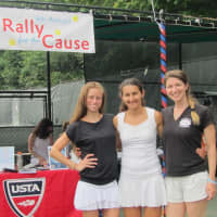 <p>Olga Harvey, center, the Rye Racquet Rally for the Cause tournament director, with the womens doubles winners from 2014.</p>