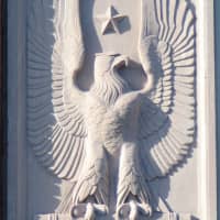 <p>One of two eagle sculptures at the top of 182 East Post Road in 1941. The photo is on exhibit at White Plains Library.</p>