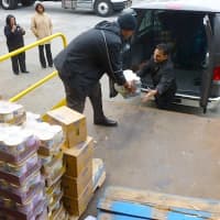 <p>Members of the Church of God of Prophecy in Mount Vernon load donations from The Food Bank for Westchester into their van for the church&#x27;s Thanksgiving soup kitchen.</p>