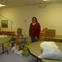 <p>Gail Lent from the Covenant Church of Easton in room used to store donated items for hurricane relief.</p>