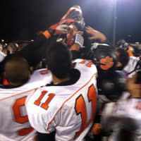 <p>The Tuckahoe Tigers football team celebrates its win Friday to advance to the state finals in Syracuse.</p>