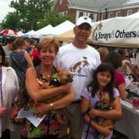 <p>From left: Claudia Weber, Lia Toth with &#x27;Peewee,&#x27; Claude Colabella, and Charlotte Frank holding &#x27;Pookie&quot; outside the Strays &amp; Others tent at the New Canaan sidewalk sale Saturday.</p>