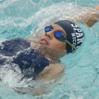 <p>Nicole Calle, of Ossining, competes in the back stroke.</p>