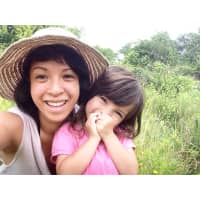 <p>Intern Kristen Gamboa, and her daughter, Sorrel, share a moment at a WLT preserve.</p>