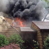 <p>A home on Long Hill Road East when up in flames Saturday.</p>