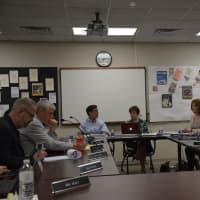 <p>Bedford Central school board members gather for a meeting on July 20.</p>