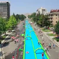 <p>Slide the city, a 1,000-foot-long water slide will be in Stamford on Sunday.</p>
