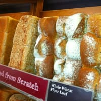 <p>Part of the &quot;wall of bread&quot; at the new COBS Bread bakery in Stamford.</p>