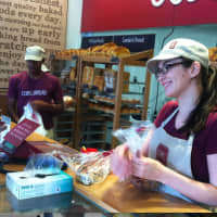 <p>COBS Bread associate Kate Donohoe helps out a customer.</p>