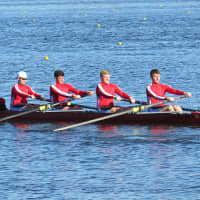 <p>Casey Fuller and rowing teammates in competition.</p>
