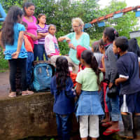 <p>A highlight of the trips is spending time with the local children, here shown with veteran volunteer Carla Berry at the party celebrating St. John&#x27;s 10th anniversary trip to Nicaragua.</p>