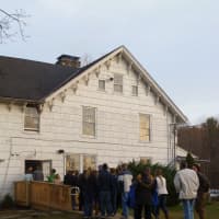 <p>The 4H group files into the 18th Century farmhouse for dinner.</p>