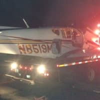 <p>The plane is towed away after crash landing near Westchester County Airport. </p>