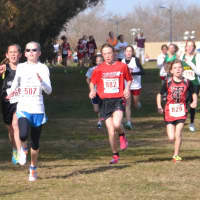 <p>Angela Saidman of the Wilton Running Club gets ahead of the pack during Sunday&#x27;s race.</p>