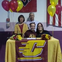 <p>Caroline Fitzpatrick with Arena Gymnastics coach Laurie DeFrancesco, right, and her parents, back row. She has committed to Central Michigan University.</p>