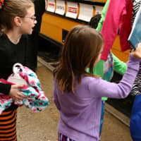 <p>Tuckahoe elementary school students with pajamas and books for the &quot;Stuff a Bus&quot; campaign. </p>